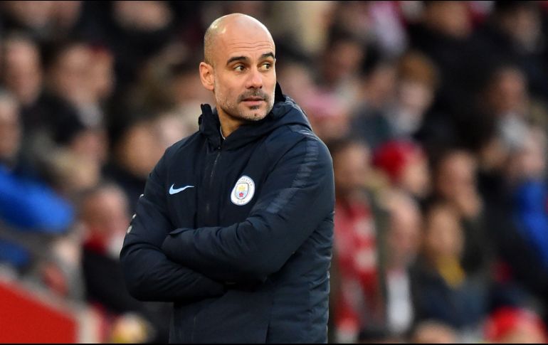 El City, dirigido por Guardiola, tiene siete puntos menos que el Liverpool, lider del campeonato inglés. AFP/G. Kirk