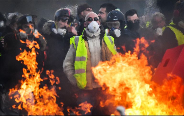 Las marchas se desarrollaron en medio de una amplia presencia policial y pese a las bajas temperaturas. AFP/L. Venance