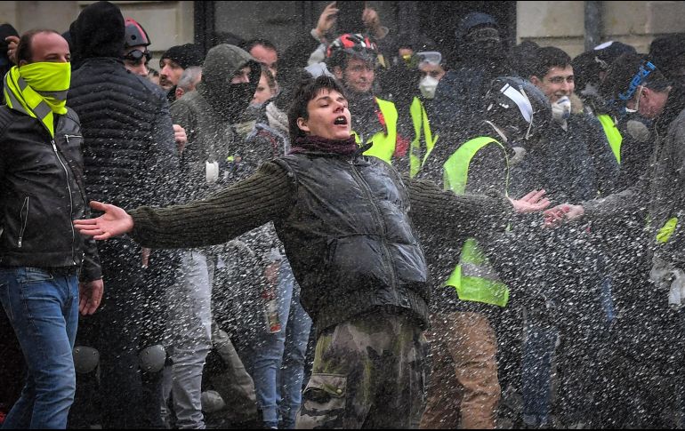 Las marchas se desarrollaron en medio de una amplia presencia policial y pese a las bajas temperaturas. AFP/L. Venance