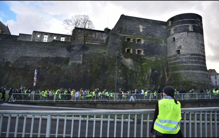 Las marchas se desarrollaron en medio de una amplia presencia policial y pese a las bajas temperaturas. AFP/L. Venance