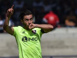 Vigón, capitán de los rojinegros, comandó la reacción de su equipo en el segundo tiempo. AFP / R. Arangua