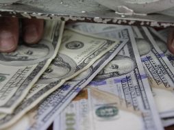 El tipo de cambio para solventar operaciones denominadas en moneda extranjera pagaderas en el país se coloca en 19.0381 pesos. EL INFORMADOR / ARCHIVO