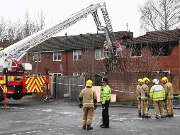 El fuego consumió la casa, cuyo techo se derrumbó, las ventanas se rompieron y las habitaciones quedaron ennegrecidas. AFP / P. Ellis