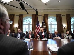 Los congresistas, entre ellos republicanos, presionaron al mandatario para que acepte el acuerdo puesto sobre la mesa ayer. AFP/M. Ngan