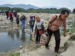 Según el informe, la mayoría de los migrantes se encuentran en Colombia, Perú, Chile, Ecuador, Argentina y Brasil. AFP / ARCHIVO