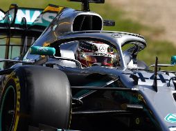 Hamilton registró una vuelta de un minuto, 23.599 segundos, 38 milésimas menos que el alemán Sebastian Vettel, de Ferrari. AFP/P. Parks