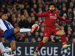 Corona (I) disputó todo el partido con el Porto; Héctor Herrera no pudo participar por acumulación de tarjetas amarillas. AFP/P. Ellis