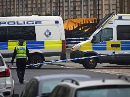 Policías locales resguardan el área donde ocurrió el tiroteo. AP/J. Barlow