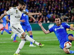 Los merengues marchan en tercer puesto, mientras el Getafe es cuarto. AFP/J. Soriano