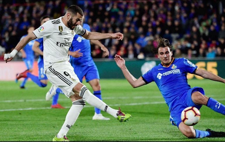 Los merengues marchan en tercer puesto, mientras el Getafe es cuarto. AFP/J. Soriano