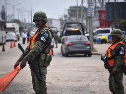Elementos de la Guardia Nacional vigilan las calles del municipio de Minatitlan, en Veracruz. EFE/A. Hernández