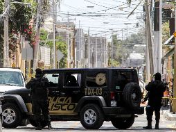 Policías resguardan el acceso a la fina en Zapopan. AFP/U. Ruiz