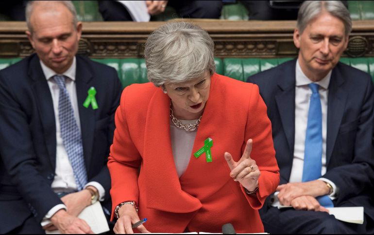 Theresa May mantiene la esperanza que su proyecto de salida de la UE sea aprobado por los legisladores en la primera semana de junio. AFP/J. Taylor-Parlamento del Reino Unido