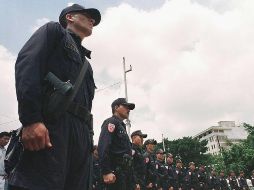 En lo que va del año, 21 policías han sido asesinados en El Slavador, a los que se suman las muertes violentas de 12 efectivos de la Fuerza Armada y un custodio penitenciario. AFP/Archivo