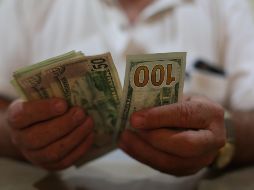 La moneda se compró en un mínimo de 18.10 pesos este lunes. EL INFORMADOR/ARCHIVO