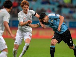 Con el empate Uruguay suma 4 puntos mientras que Japón suma su primera unidad en el grupo C. AFP / C. de Souza