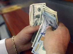 El peso mexicano pierde terreno frente al dólar estadounidense en los mercados internacionales, luego de que dimitiera de su cargo el titular de la Secretaría de Hacienda. EL INFORMADOR / ARCHIVO