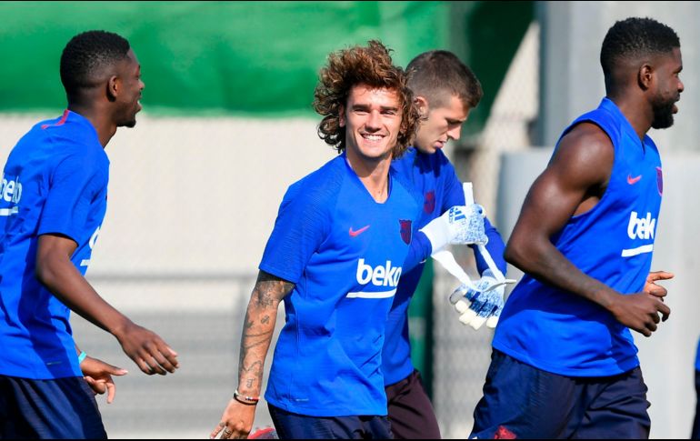 El campeón del mundo con su selección fue presentado el domingo tras firmar por las próximas cinco temporadas con el conjunto azulgrana. AFP / L. Gene
