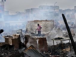 La mayoría de casas estaban construidas con material inflamable y madera. AFP/L. González