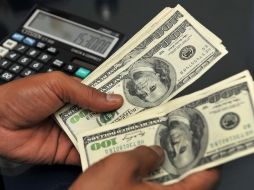 Se espera que durante la mañana el tipo de cambio cotice con estabilidad cerca de 19 pesos por dólar, debido a que participantes del mercado permanecen a la espera del anuncio de política monetaria de la Reserva Federal. AFP / ARCHIVO