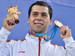 Brasil y Estados Unidos se llevaron el oro y la plata; Ricardo Vargas posa con su medalla. AFP/L. Robayo