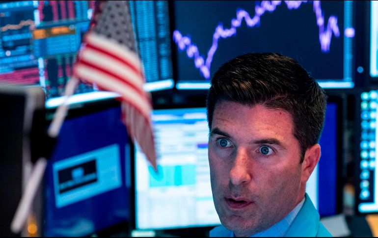 La tensión comercial entre Washington y Beijing y el colapso de los mercados argentinos influyen en la caída de Wall Street. AFP / J. Eisele