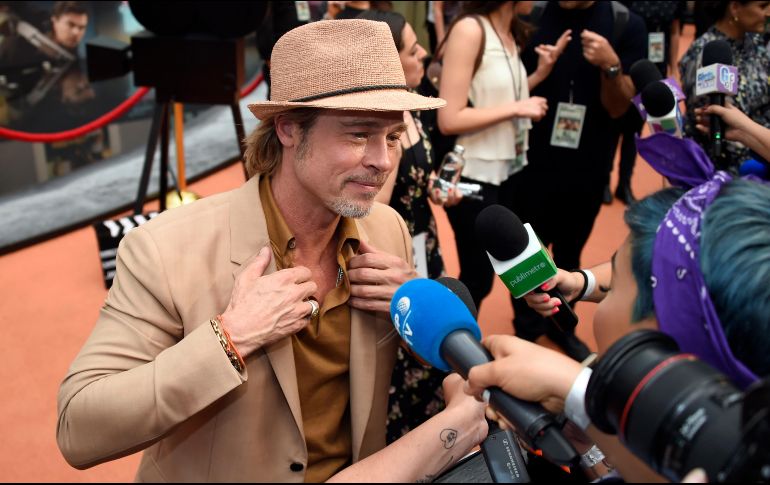 Relajado, con sombrero y su característica sonrisa, Brad pitt compartió un poco de lo que espera del filme. AFP / A. Estrella