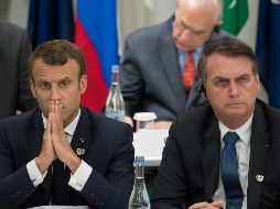 El comentario de Jair Bolsonaro (d) se produjo tras una guerra verbal con Emmanuel Macron (i) por el significativo aumento este año de los incendios forestales que destruyen parte de la Amazonía. AFP/ARCHIVO