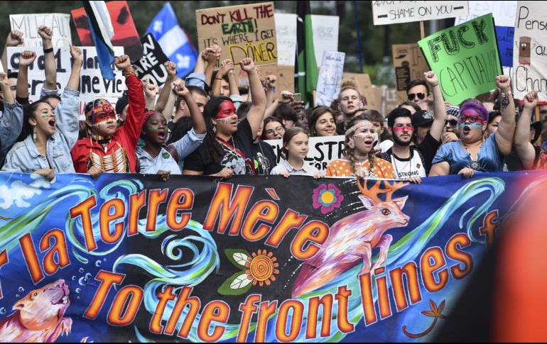 La marcha multitudinaria arrancó a primera hora de la tarde en el centro de la capital de Quebec, en medio de una atmósfera festiva. AFP/M. Panagiotakis