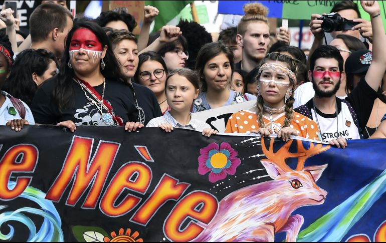 La marcha multitudinaria arrancó a primera hora de la tarde en el centro de la capital de Quebec, en medio de una atmósfera festiva. AFP/M. Panagiotakis