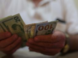 La divisa estadounidense reporta una ganancia de nueve centavos más que el cierre previo. EL INFORMADOR / ARCHIVO