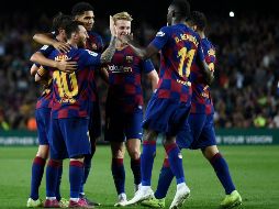 El triunfo permite al Barça situarse segundo en el campeonato, con dos puntos menos que el Real Madrid. AFP / J. Lago