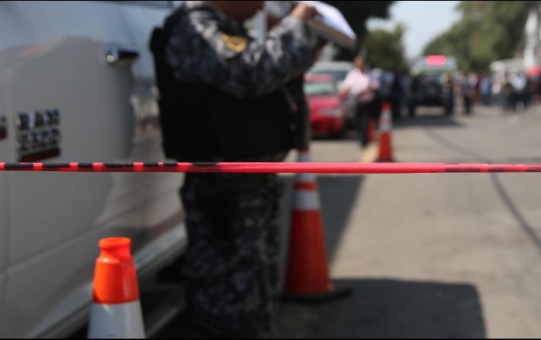 Elementos de la Guardia Nacional, el Ejército y la Policía de Michoacán resguardan la zona tras el ataque. EL INFORMADOR/ARCHIVO