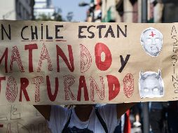 Dieciocho personas han muerto en Chile, algunas de ellas a manos de militares. AFP/R. Arangua