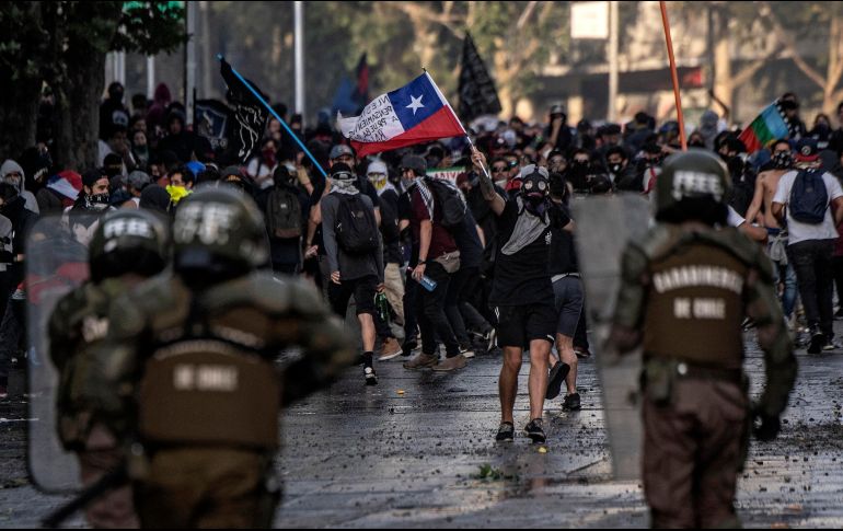 El presidente Sebastián Piñera canceló los planes de hospedar el evento entre el 2 y el 13 de diciembre, junto con los planes de organizar una cumbre de la APEC, debido a los disturbios. AFP / P. Ugarte