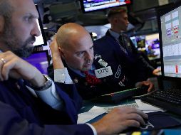 El índice Dow Jones abrió operaciones con un alza de 49.11 puntos. AP / R. Drew