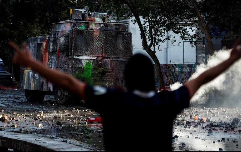 Un grupo de asaltantes aprocechó el caos de la manifestación para robar 200 mil dólares de un banco. ARCHIVO / EFE