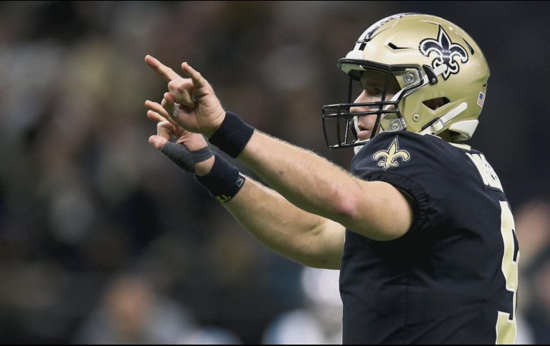 Drew Brees ha comandado al equipo de los Saints a ganar dos títulos divisionales consecutivos y hoy podría concretar un tercer cetro de su zona. AFP / C. Graythen