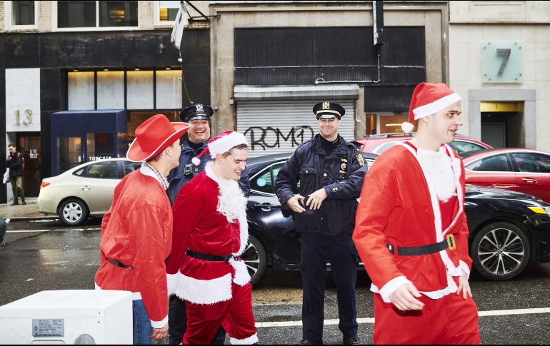 Muchos de los participantes lucieron sus mejores galas navideñas en el evento. AFP/G. Jones