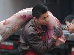 Los nuevos recortes arancelarios se aplicarán principalmente a productos de uso diario o de los que hay escasez, como la carne de cerdo. AFP/Archivo