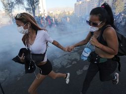 El  21 de octubre, un manifestante sufrío una contusión en un ojo y fracturas en la nariz y las costillas durante la dispersión de una protesta antigubernamental. AP/F. Llano