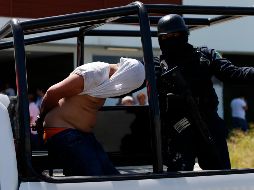 En el operativo se detuvo a 12 integrantes de la banda. AP/ARCHIVO