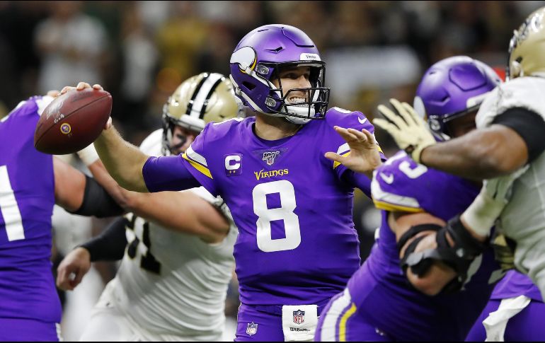 Cousins se conectó con Kyle Rudolph para sellar el triunfo de los Vikingos. AFP / K. Cox