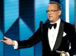 La actriz Charlize Theron fue la encargada de entregar el premio honorífico a Hanks. AP / P. Drinkwater