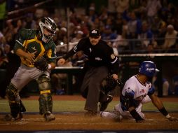 Henry Urrutia se barre en home para marcar una de las carreras de los Charros. EL INFORMADOR/F. Atilano