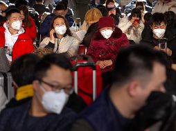 Autoridades chinas y la OMS han recomendado el uso de mascarillas como medida para prevenir la infección. AP/M. Schiefelbein