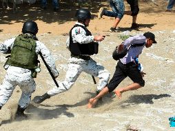 El informe es sobre el enfrentamiento entre migrantes centroamericanos y elementos de la Guardia Nacional en días pasados en la frontera sur. AFP / I. Guzmán
