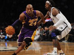 Kobe Bryant debutó en la NBA como un adolescente muy promocionado en 1996, el jugador más joven en la historia de la liga en ese momento. AFP / ARCHIVO