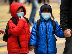 Niños usan mascarillas este lunes en Hong Kong. AFP/A. Wallace