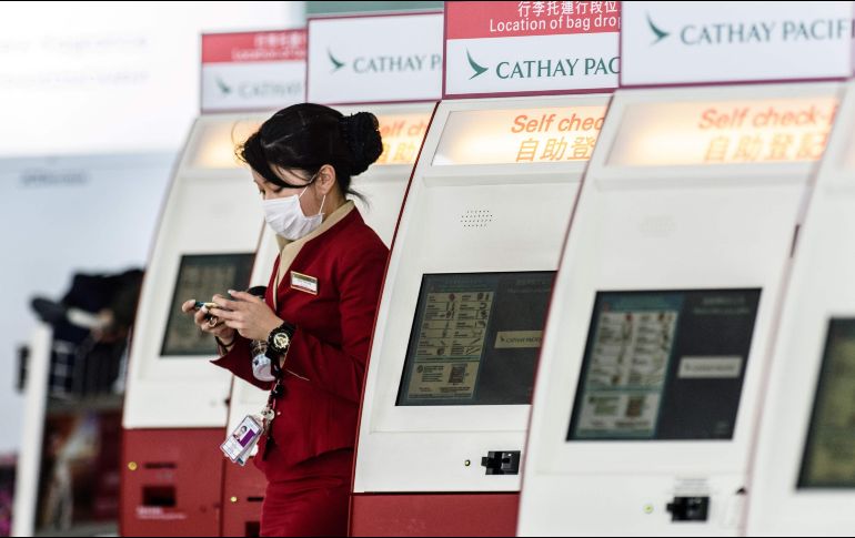 La solicitud incluye a toda la plantilla de Cathay Pacific, compuesta por 27 mil empleados. AFP/ARCHIVO